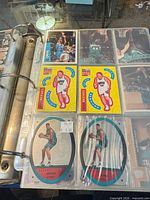 Open binder showing multiple 9-pocket pages of Vancouver Grizzlies cards