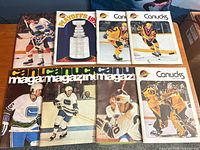All eight vintage Vancouver Canucks magazines displayed