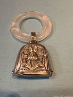 Front view showing lucite ring and silver rabbit plaque