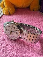 Side view of Bulova watch showing stainless steel expansion band and case profile