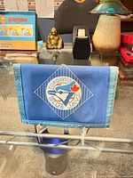 Wallet front closed showing logo and trim