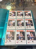 Binder page showing nine Zellers Master Hockey cards
