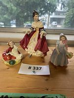 Front view of all three Royal Doulton figurines together
