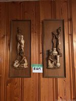 Front view showing both Girotti relief plaques side by side