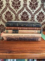 Stack of five antique/vintage Roycroft books showing spines and bindings