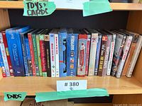 Shelf with full row of DVD and audio cases