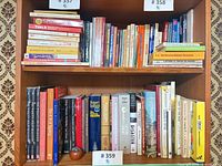 Full view of two shelves showing the bulk of paperback collection