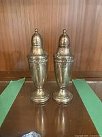 Front view of both sterling weighted shakers side by side