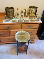 Overview of all brass items on dresser and side table