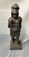 Full front view of bronze Roman soldier statue with spear