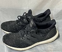 Side view of entire pair showing uppers, midsoles and branding