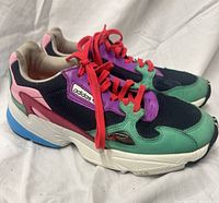 Side view of both sneakers showing multicolor uppers and laces