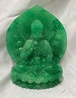 front view of carved green jade Buddha statue