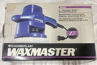 Front of retail box showing Chamberlain Waxmaster polisher, model W6000, 6" random orbit, 7-year warranty