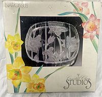 Front of retail box showing platter and floral artwork