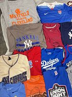Overview of assorted team T-shirts, jerseys and tank
