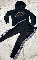 Hoodie and sweatpants laid flat full view