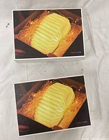 Front view showing two boxed Organ Lamps