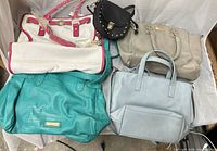 Group shot of five assorted purses arranged together