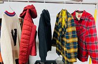 all five jackets hanging on rack