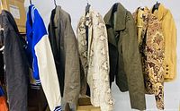 All seven jackets hanging on rack