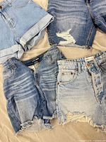 Overview of five pairs showing various washes and distressing