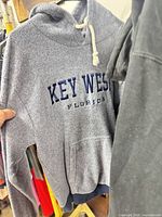 Grey Key West Florida hoodie on rack
