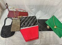 Group shot of all eight clutches and small purses