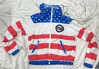 Front view of entire jacket showing design, pockets, zipper and hood