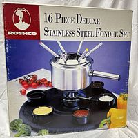 Front of sealed retail box displaying full fondue set