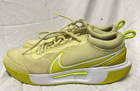 Left side view of both shoes showing uppers, swoosh, midsole, lace area