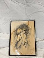 Framed drawing showing full artwork with water stains and frame