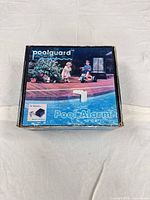 Front view of Poolguard Pool Alarm retail box