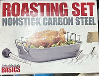box showing Tools of the Trade Basics nonstick carbon-steel roasting set with images of included pan, rack, baster and lifters