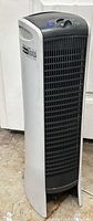Front three-quarter view of Sharper Image Hybrid GP tower air purifier showing grille, branding and overall condition