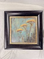 Front view of square framed artwork showing subject and colors