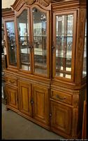 Full view of two-piece Thomasville Place Vendome hutch showing upper glass display and lower buffet base