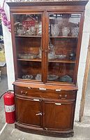 Full view of wood china cabinet showing glass hutch, drawers, lower cabinet