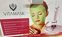 Box showing VITAMASK branding, model image and example mask application