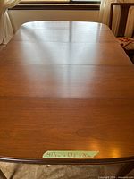 Top view of dining table showing entire rectangular surface and dimension tape
