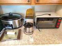 Overview showing large Crock-Pot, mini slow cooker, popcorn popper, toaster oven