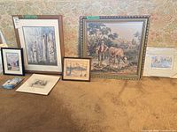 Group shot of all four art pieces lined against wall