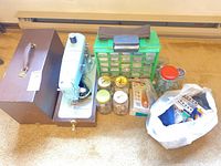 Overview of sewing machine, case, organizer, jars, bag of accessories