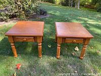 Both oak side tables front view outdoors