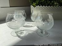 Four crystal brandy glasses front view