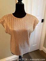 Front view of gold cap sleeve top on mannequin