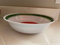 Side view of white Coca-Cola bowl showing depth and condition
