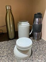 Three beverage containers displayed together