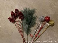 Group shot of all floral picks, pinecones, greenery and glitter balls