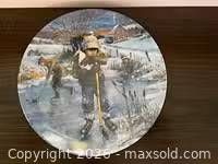 Front of collector plate showing winter skating scene